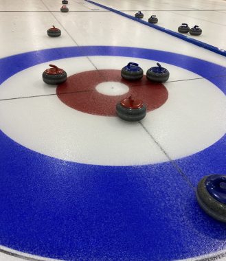 wheelchair curling | Neuromyelitis News | Lelainia's rocks land on the button during her first curling game