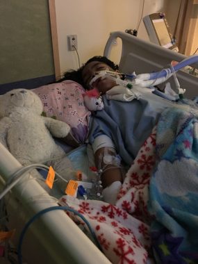 breathing problems while sleeping | Neuromyelitis News | Bella sleeping in her hospital bed during an NMO flare. She is intubated and surrounded by blankets and stuffed animals from home.