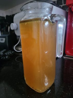 health benefits bone broth | Neuromyelitis News | photo of the broth itself, in a storage container