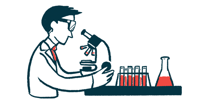 A scientist looks into a microscope in a laboratory.